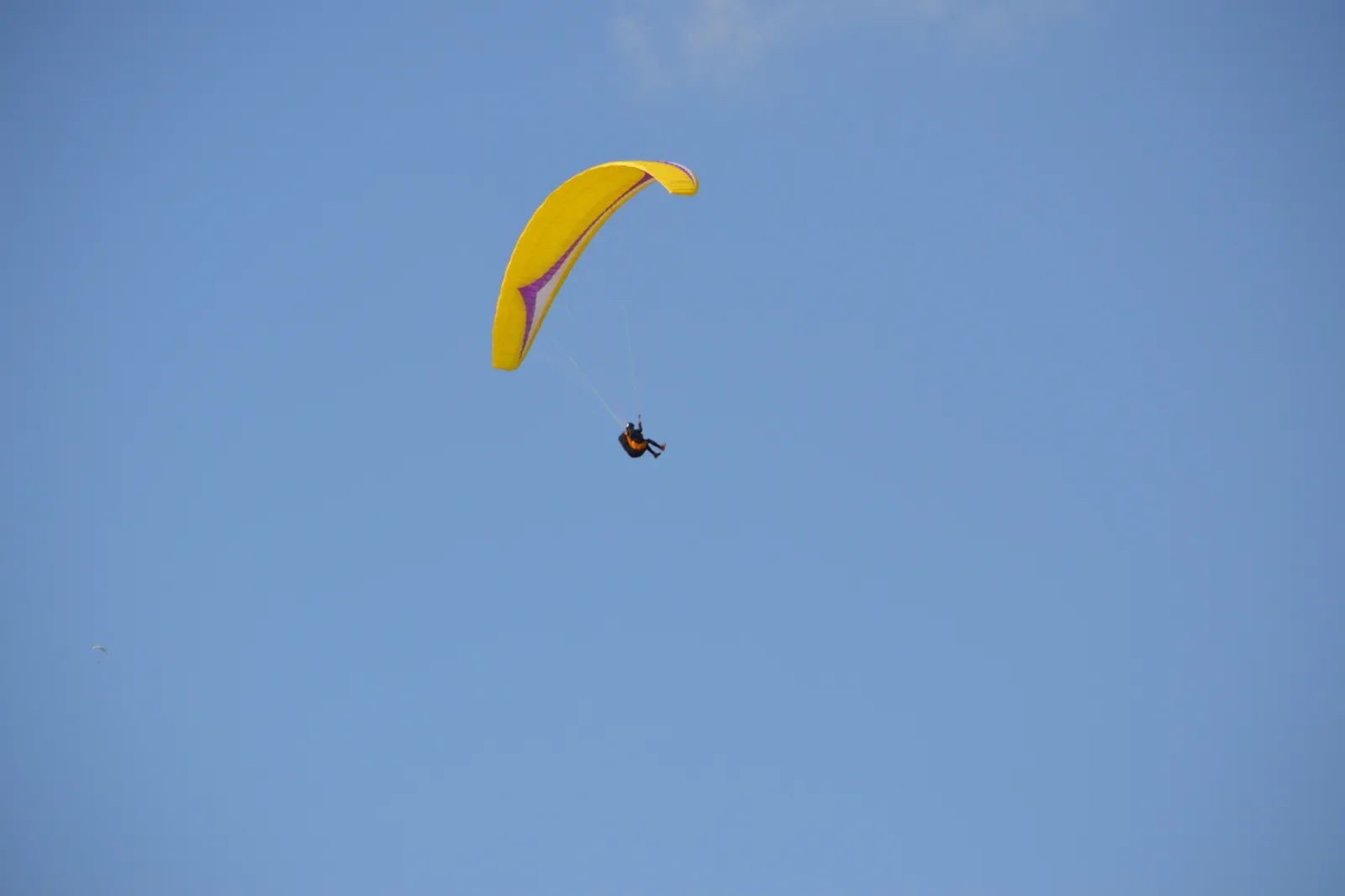 Paraglider over Pokhara with the Annapurna range